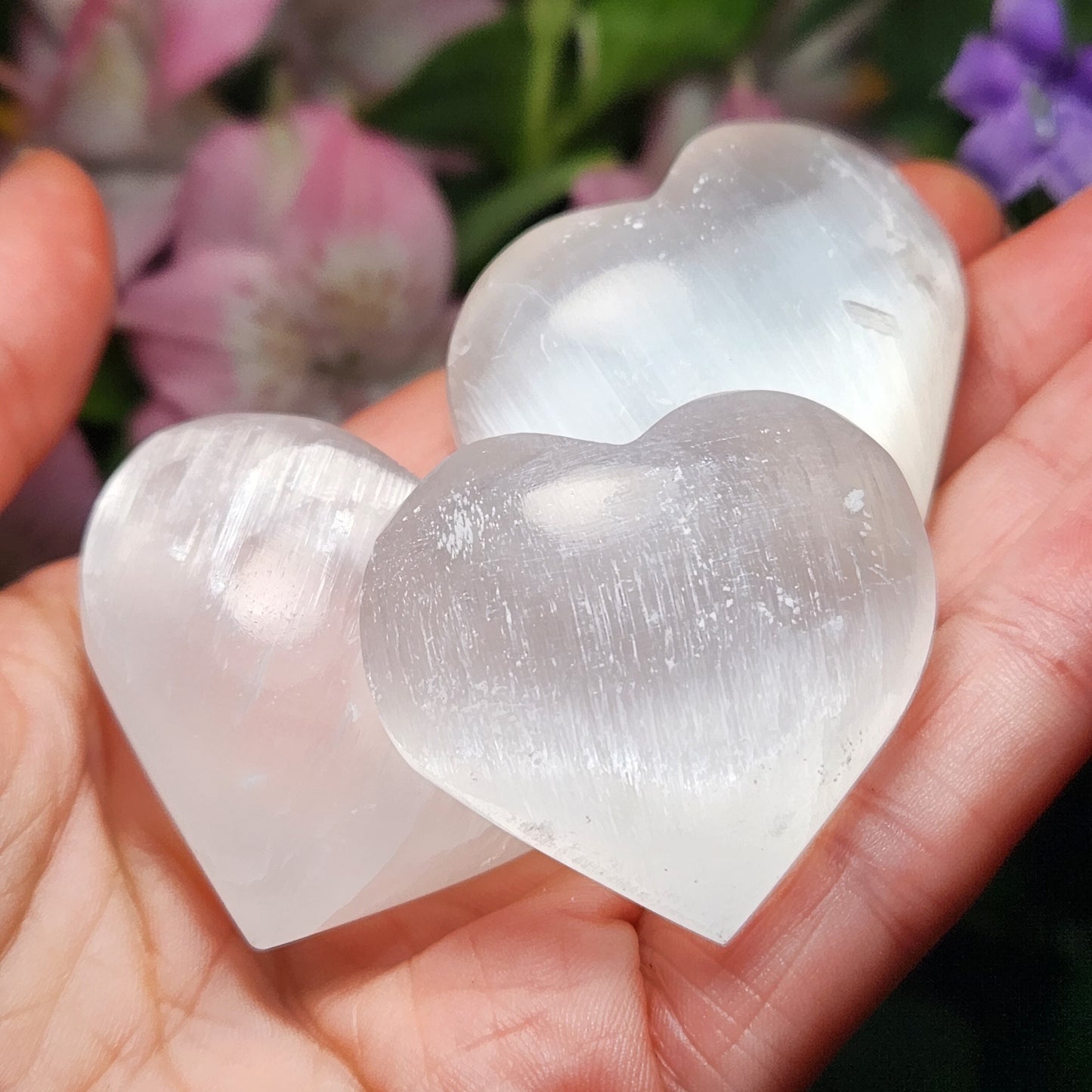 May include: Three white selenite heart shaped crystals