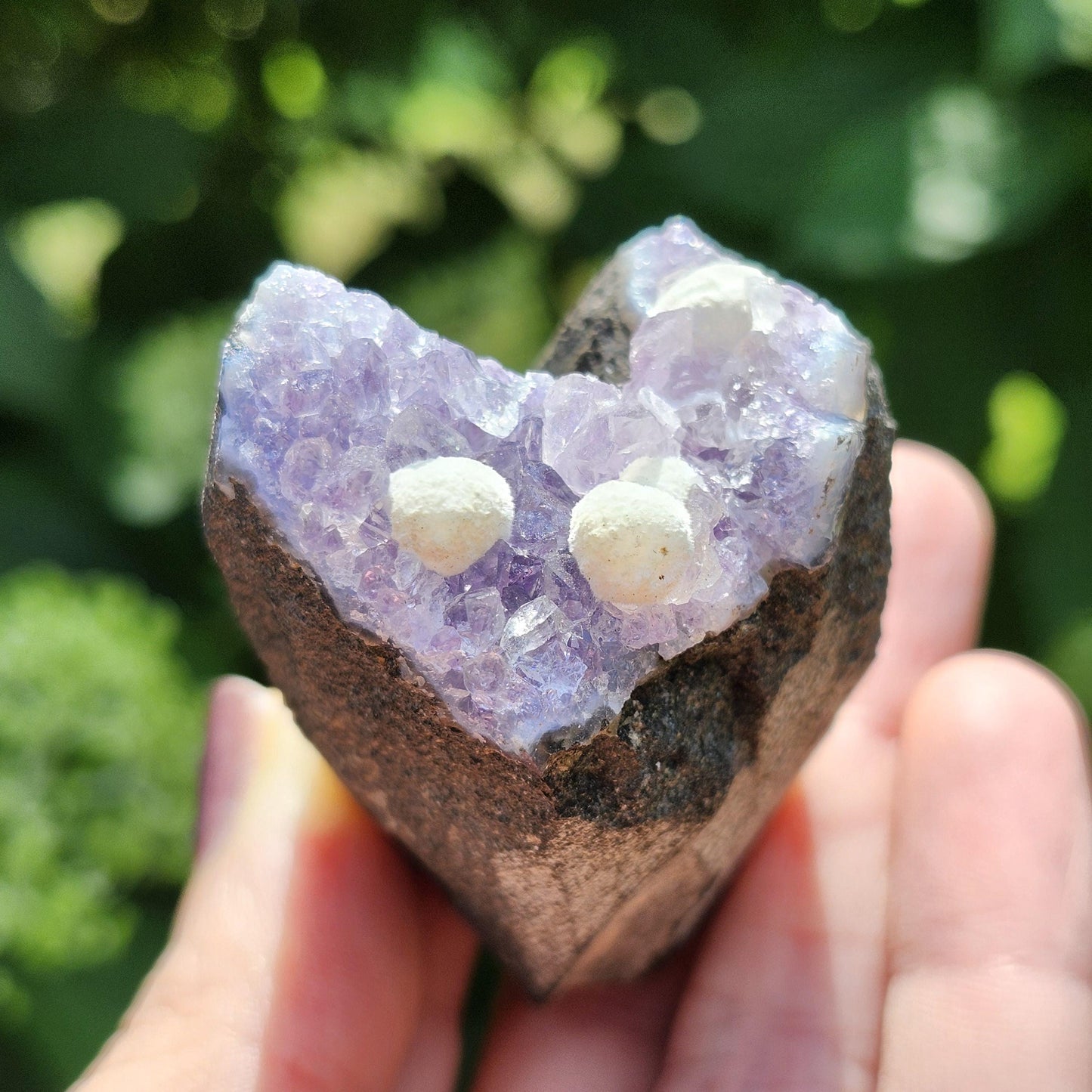 Mordenite Spheres on Amethyst