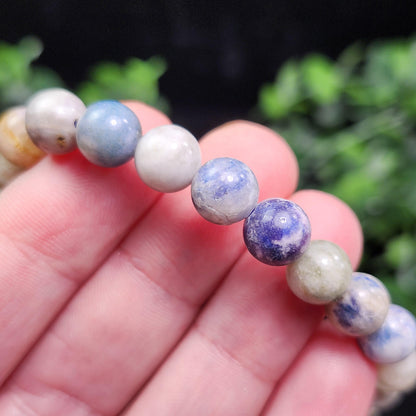Hackmanite Crystal Bracelet: UV Reactive Polished Hackmanite Beads