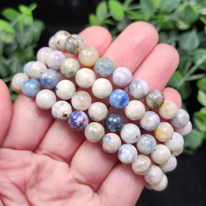 Hackmanite Crystal Bracelet: UV Reactive Polished Hackmanite Beads
