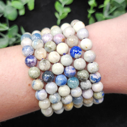 Hackmanite Crystal Bracelet: UV Reactive Polished Hackmanite Beads