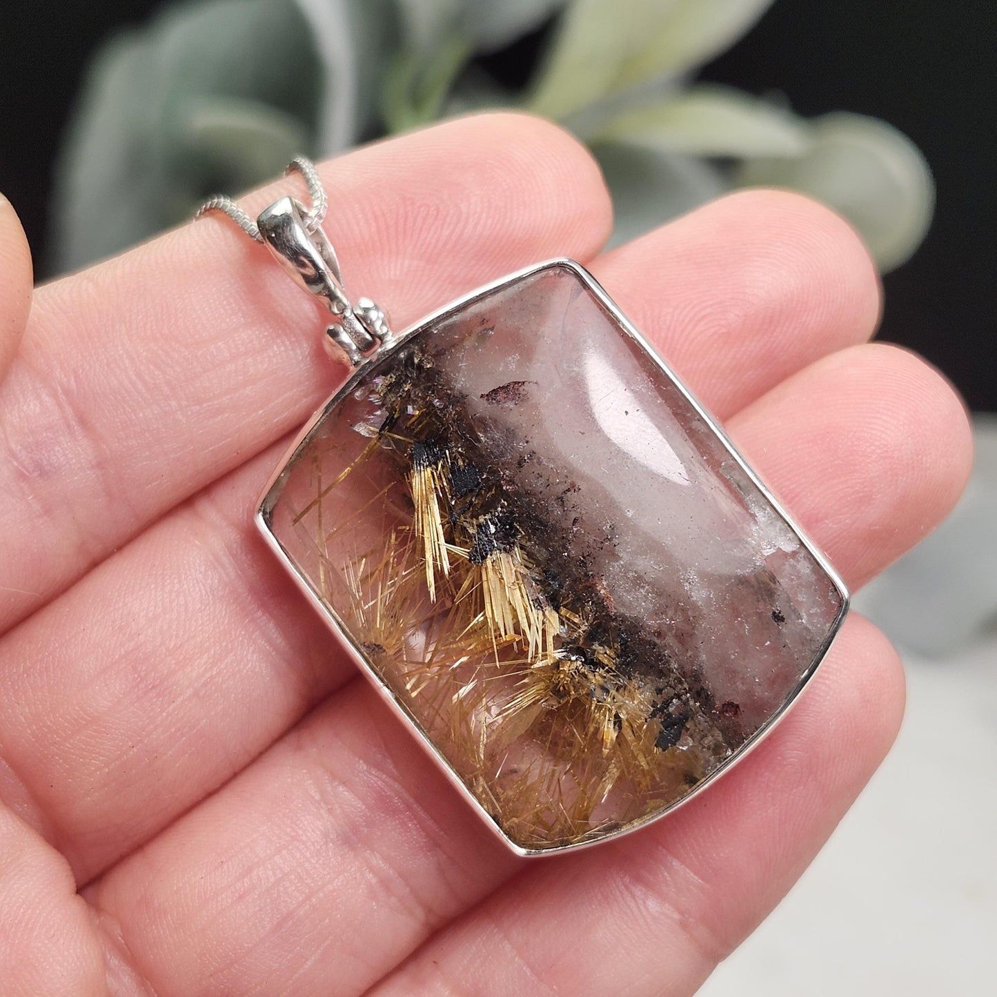 Rutilated Hematite Star in Quartz Pendant