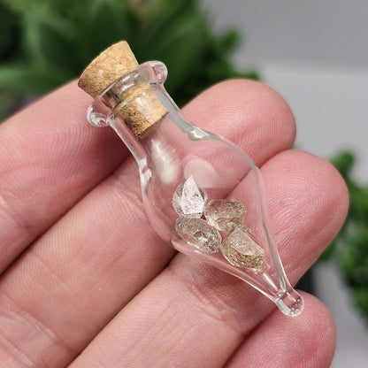 Enhydro Petroleum Quartz in Glass Jar: UV Reactive Petroleum Enhydro Diamond Quartz Crystals