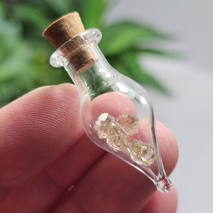 Enhydro Petroleum Quartz in Glass Jar: UV Reactive Petroleum Enhydro Diamond Quartz Crystals