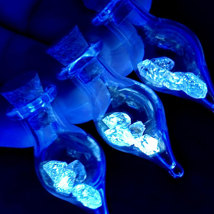 Enhydro Petroleum Quartz in Glass Jar: UV Reactive Petroleum Enhydro Diamond Quartz Crystals