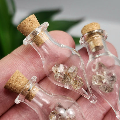 Enhydro Petroleum Quartz in Glass Jar: UV Reactive Petroleum Enhydro Diamond Quartz Crystals