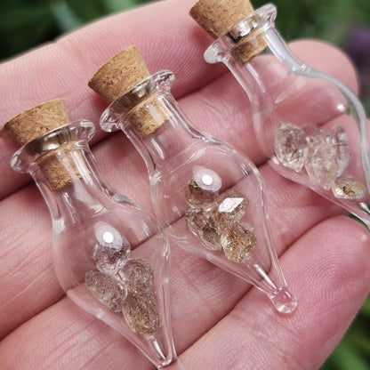 Enhydro Petroleum Quartz in Glass Jar: UV Reactive Petroleum Enhydro Diamond Quartz Crystals