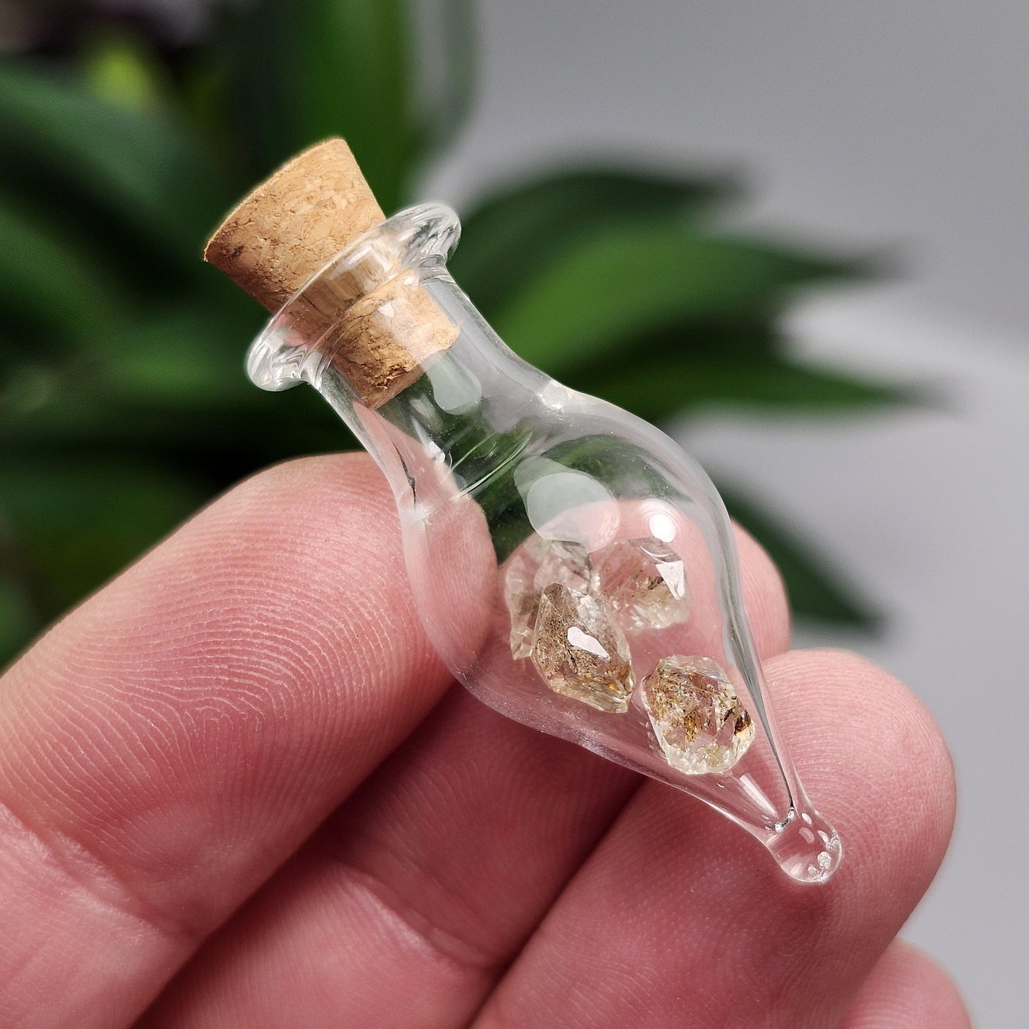 Enhydro Petroleum Quartz in Glass Jar: UV Reactive Petroleum Enhydro Diamond Quartz Crystals