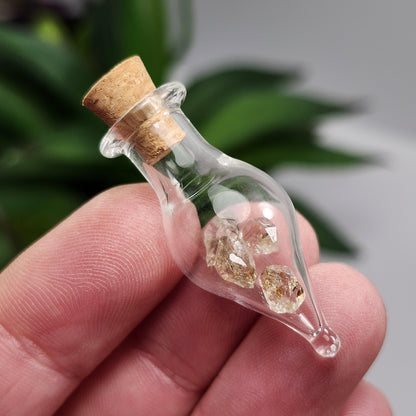 Enhydro Petroleum Quartz in Glass Jar: UV Reactive Petroleum Enhydro Diamond Quartz Crystals