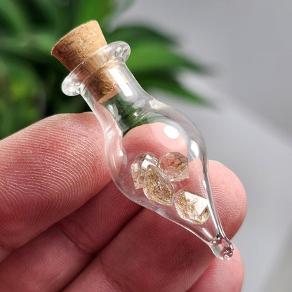 Enhydro Petroleum Quartz in Glass Jar: UV Reactive Petroleum Enhydro Diamond Quartz Crystals