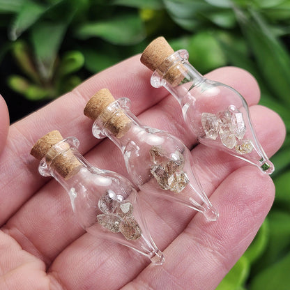 Enhydro Petroleum Quartz in Glass Jar: UV Reactive Petroleum Enhydro Diamond Quartz Crystals