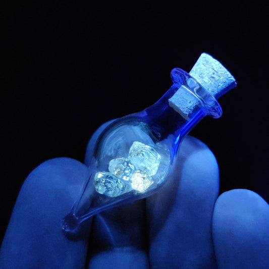 Enhydro Petroleum Quartz in Glass Jar: UV Reactive Petroleum Enhydro Diamond Quartz Crystals